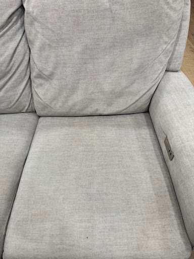 The same sofa cushion after cleaning, the fabric even in color again