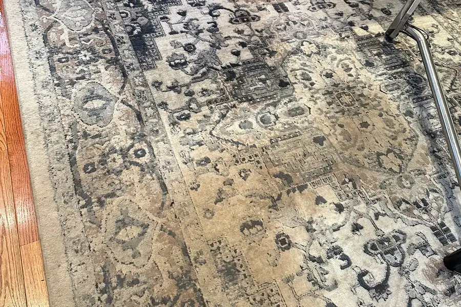A wool rug before cleaning, dulled and flattened by soil