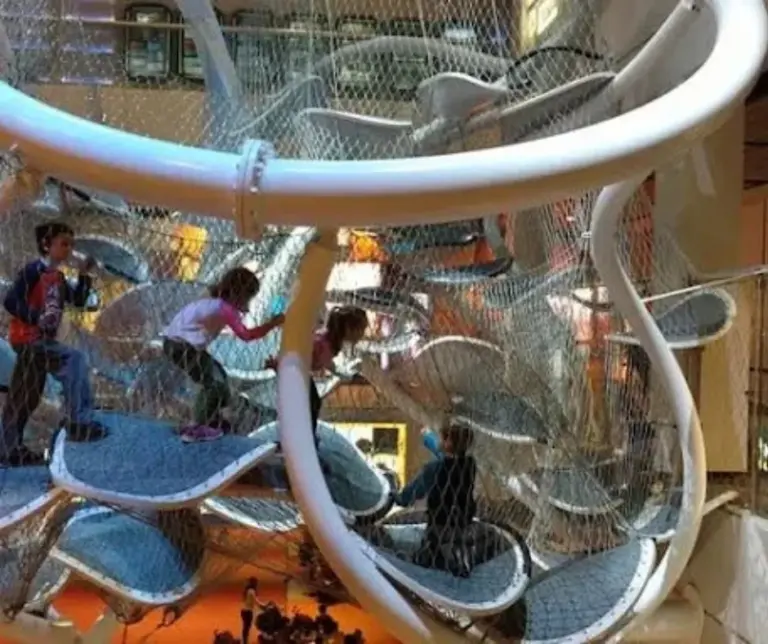 Interactive exhibits inside the Liberty Science Center, featuring futuristic technology displays and educational installations for children and adults.